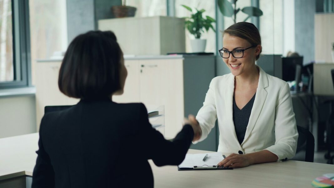 U.S. Hiring Rose in August but Remained Below a Year Earlier, LinkedIn Data Shows Representative recruiting interview image for U.S. hiring-trend coverage. Photo by Vitaly Gariev on Unsplash.