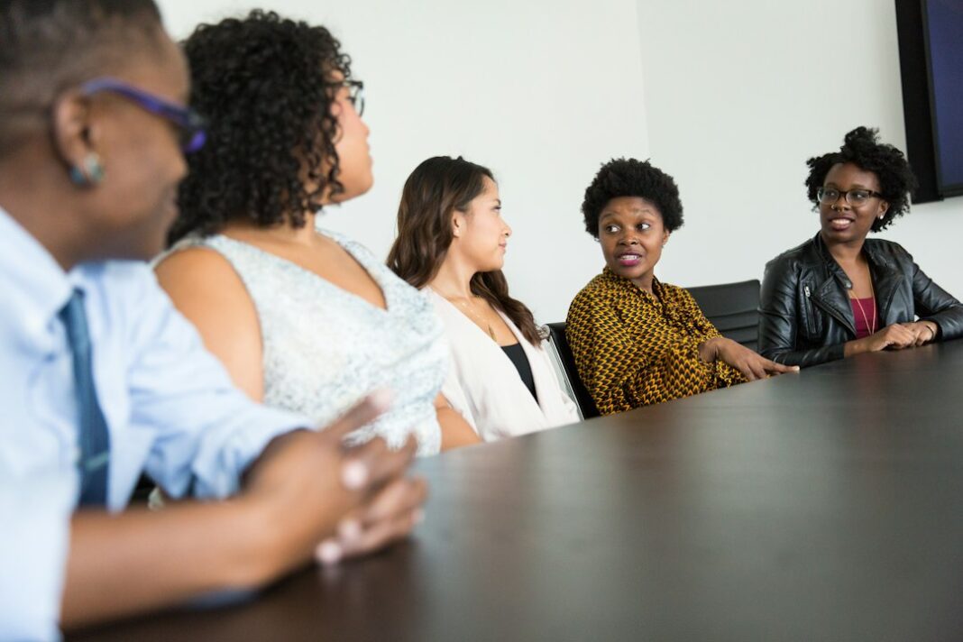 Representative workplace recruiting discussion for robotics hiring coverage. Photo by Christina at wocintechchat.com on Unsplash.