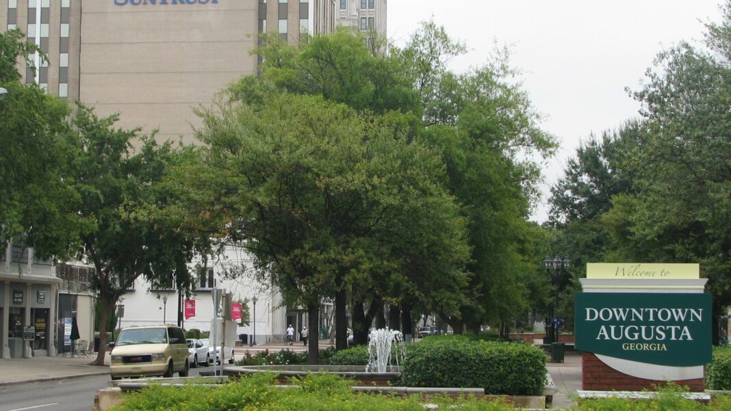 Augusta Job and Resource Fair Scheduled for October 20 at Washington Road Site A tree-lined stretch of Broad Street in downtown Augusta with a Downtown Augusta sign and office buildings behind