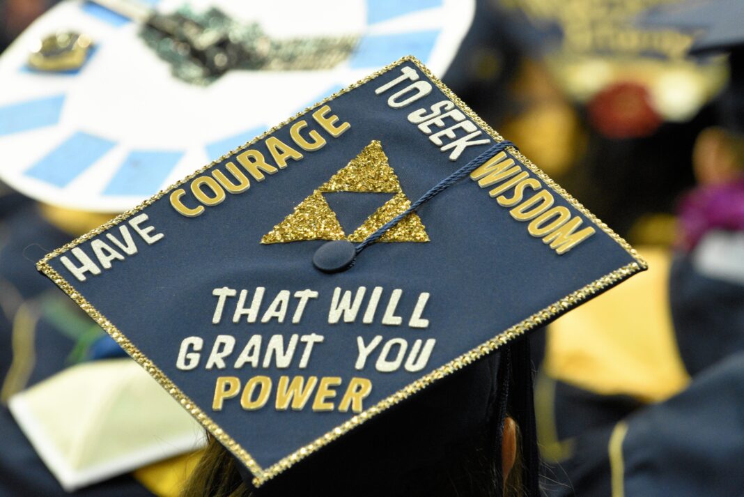 A decorated graduation cap reading 