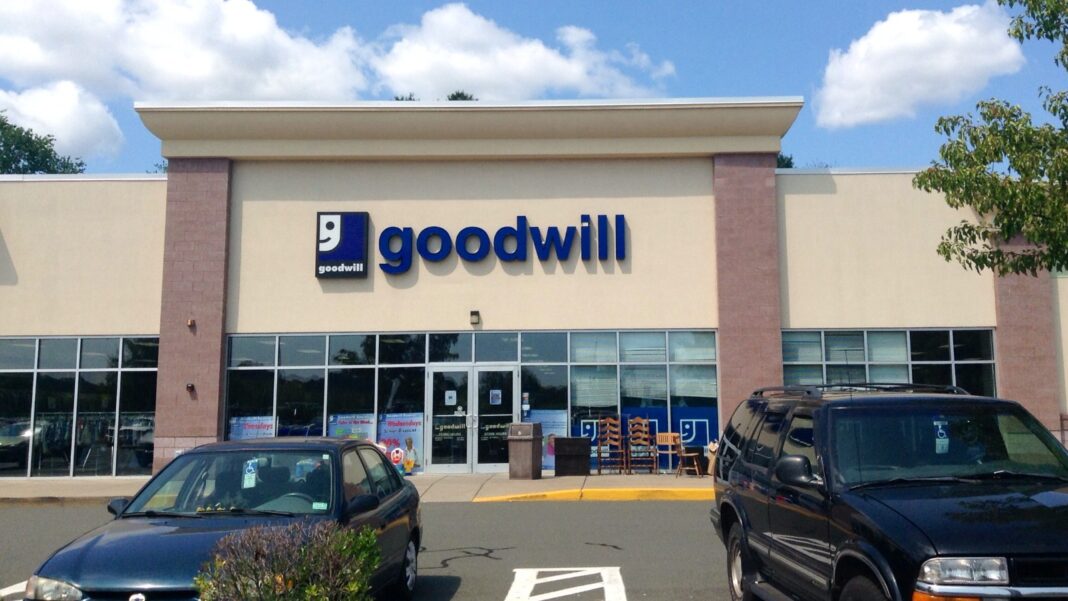 Goodwill Sets October 13 Hiring Events Across Its Southeast Georgia Stores The exterior of a Goodwill retail store with its blue logo above the entrance and cars in the parking lot