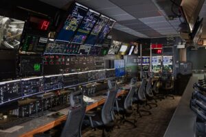 An engineer monitors data screens in a control room at NASA Glenn Research Center
