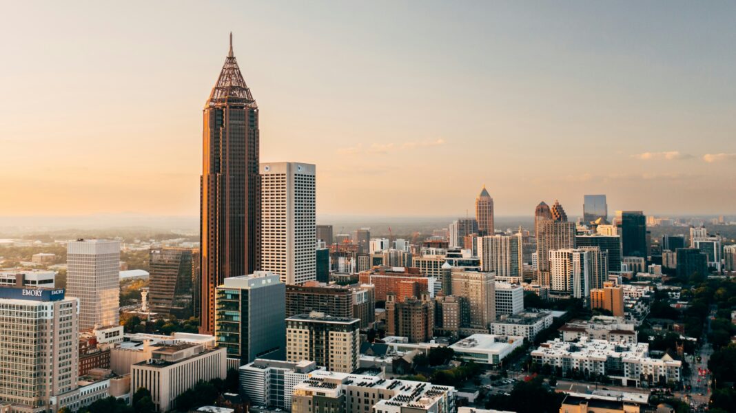Georgia Tourism Supported Nearly 474,000 Jobs in 2025, State-Commissioned Study Says Aerial view of Atlanta skyline, used as a representative image for Georgia tourism employment.