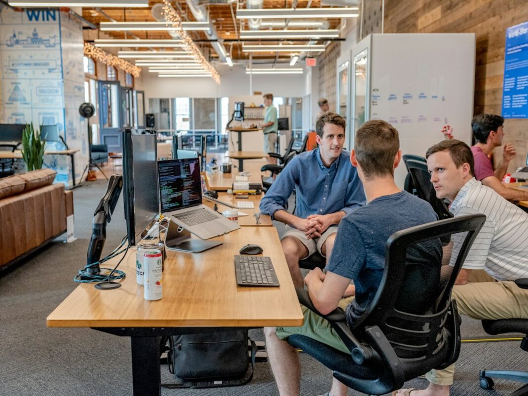 Finance Teams Spend 26% of Their Workweek Checking AI Output, Survey Finds A business team in a meeting, used as a representative image for finance work and AI.