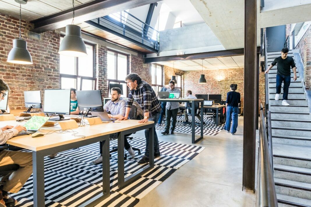 People working together in an office, used as a representative image for private-sector hiring.