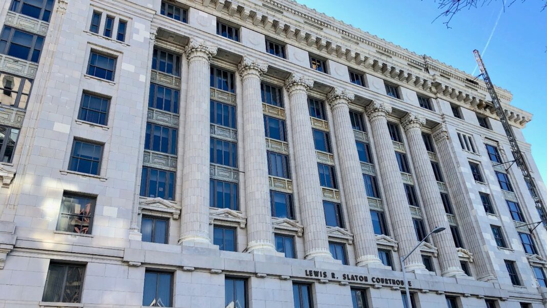 Develop Fulton Funds Free AI Training for at Least 500 Residents and Municipal Workers The white stone facade of the Fulton County Courthouse in downtown Atlanta, with tall columns and rows of windows against a blue sky